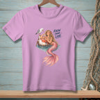 Pink t-shirt with a mermaid and seagull graphic that reads "KNOW YOUR LANE."