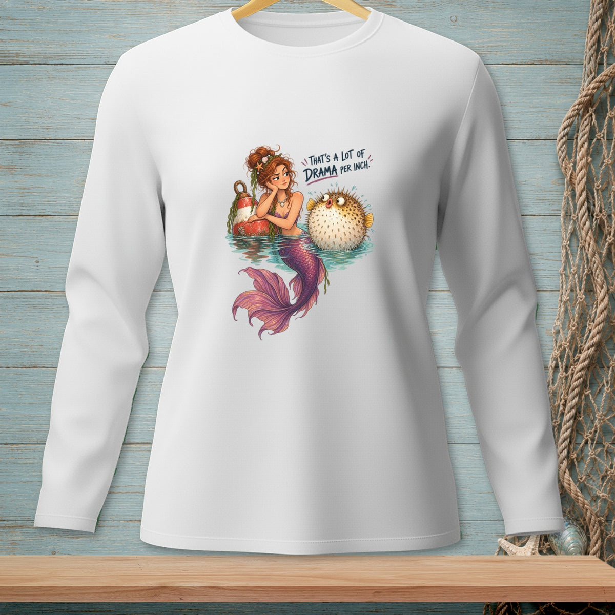 Mermaid and pufferfish graphic with text "That's a lot of drama per inch."