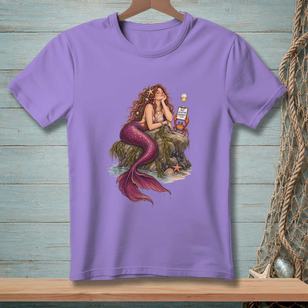 Purple t-shirt with mermaid sitting on a rock, text "Not accepting feedback".