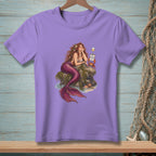 Purple t-shirt with mermaid sitting on a rock, text "Not accepting feedback".