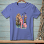 Mermaid with pink tail and cocktail by pilings, with crab and text.