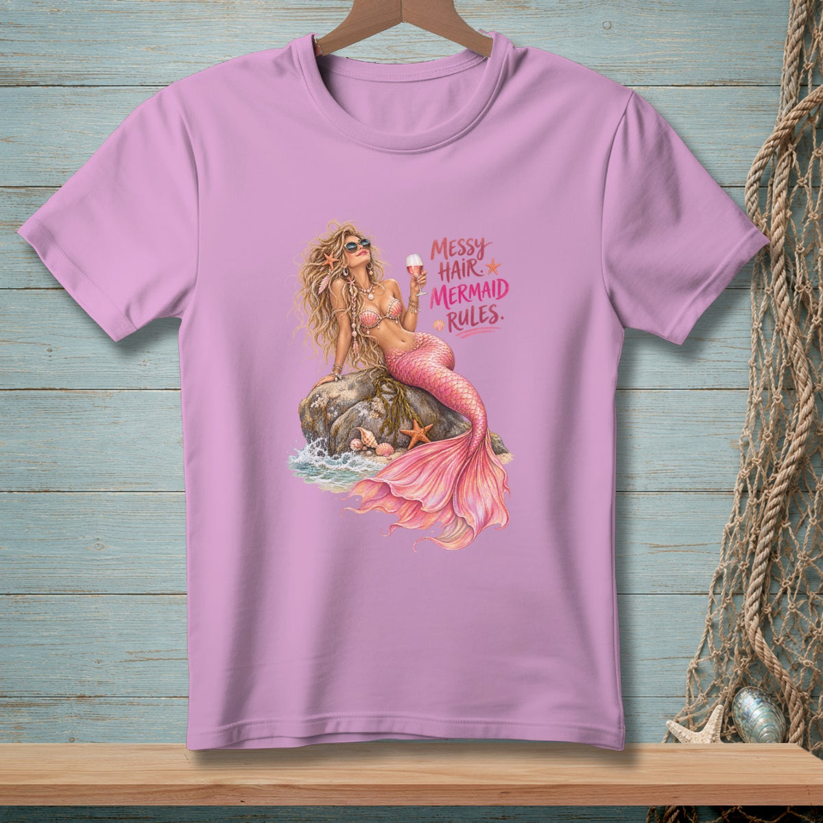 Pink t-shirt with a mermaid graphic that reads "Messy Hair Mermaid Rules."