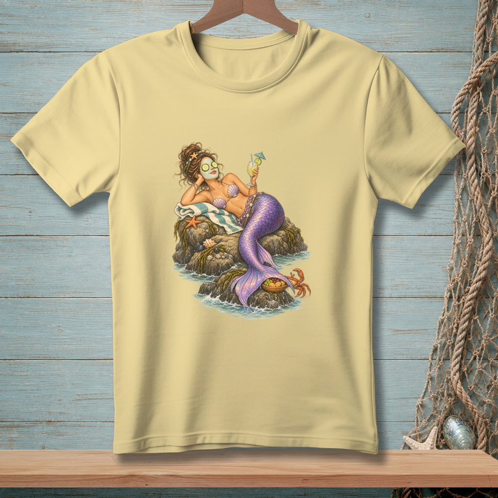 Mermaid with cucumber eyes relaxing on rocks, holding a drink.