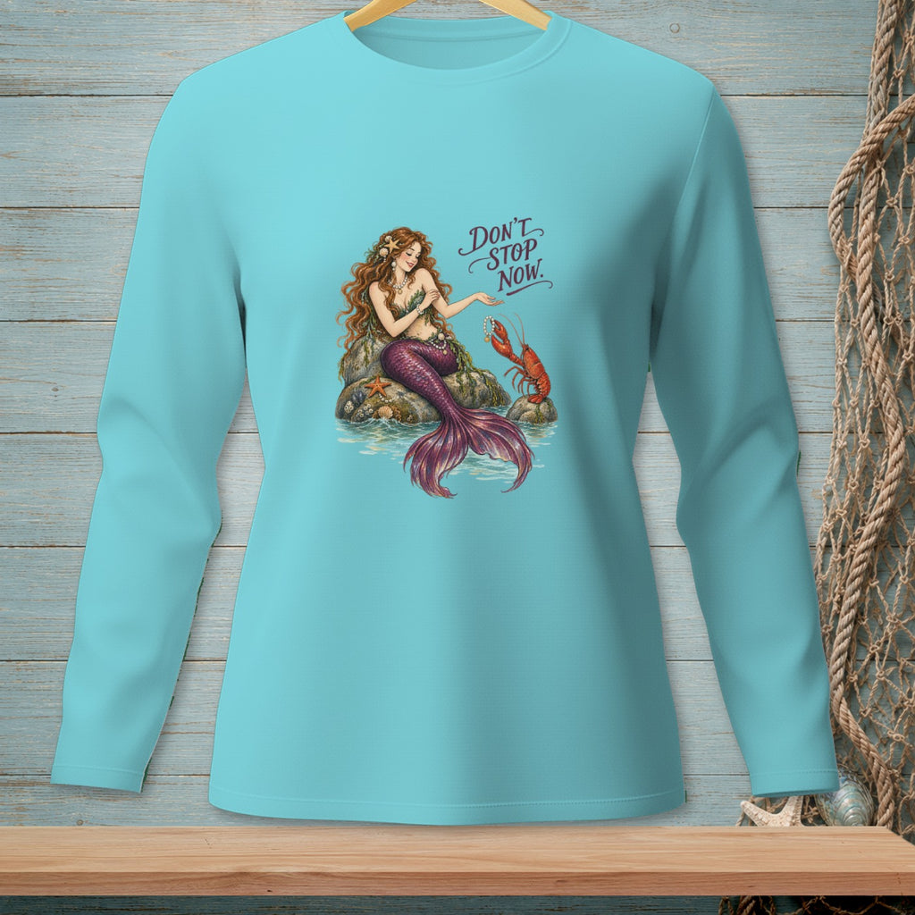 Mermaid with lobster and text "Don't Stop Now" on a teal long-sleeve shirt.