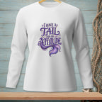 White long-sleeve shirt with purple text and mermaid tail: "I HAVE A TAIL AND AN ATTITUDE".