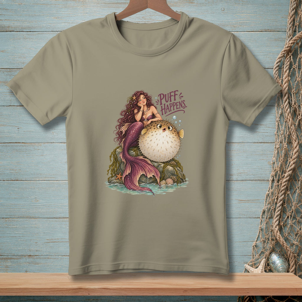 Mermaid with a pufferfish on a rock, text says "Puff Happens."