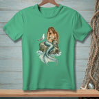 Green t-shirt with a mermaid sitting on a rock with a seagull and a plate.