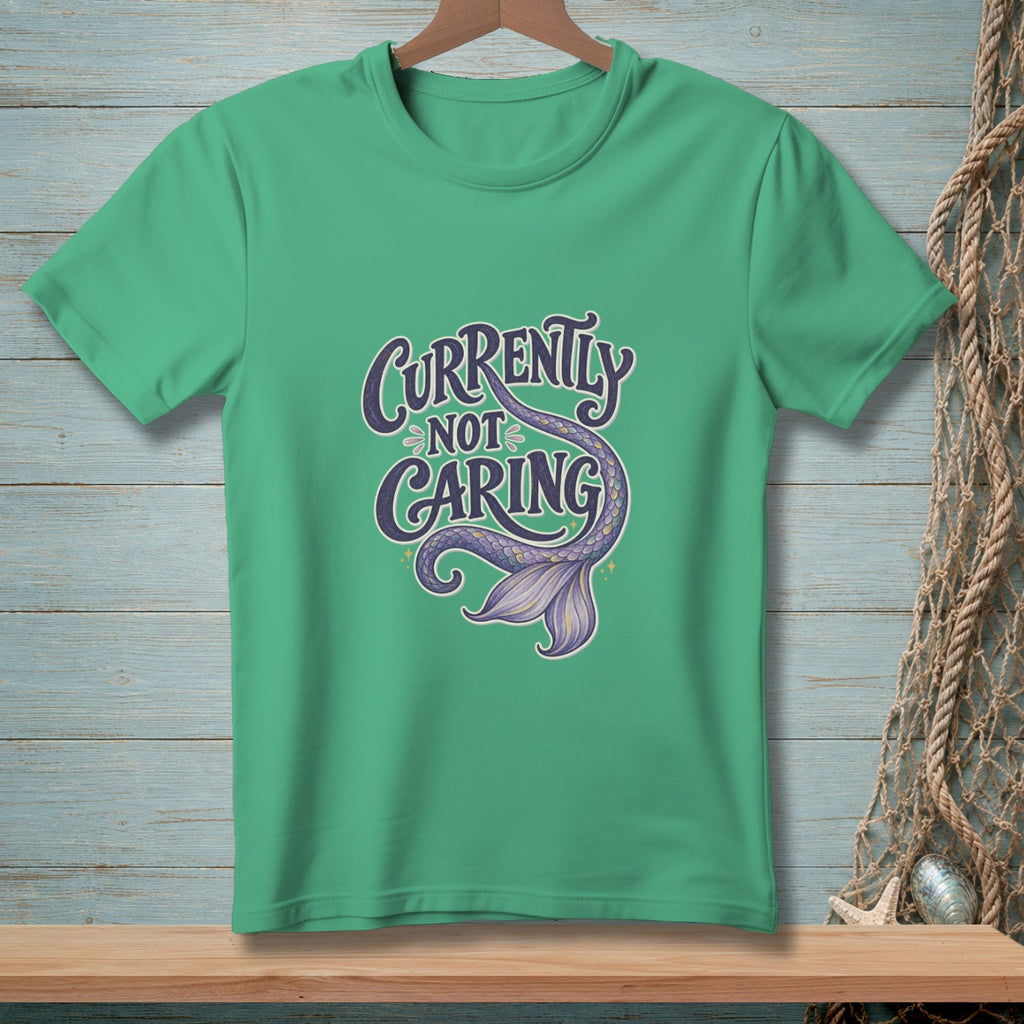 Green t-shirt with text "Currently Not Caring" and a purple mermaid tail.