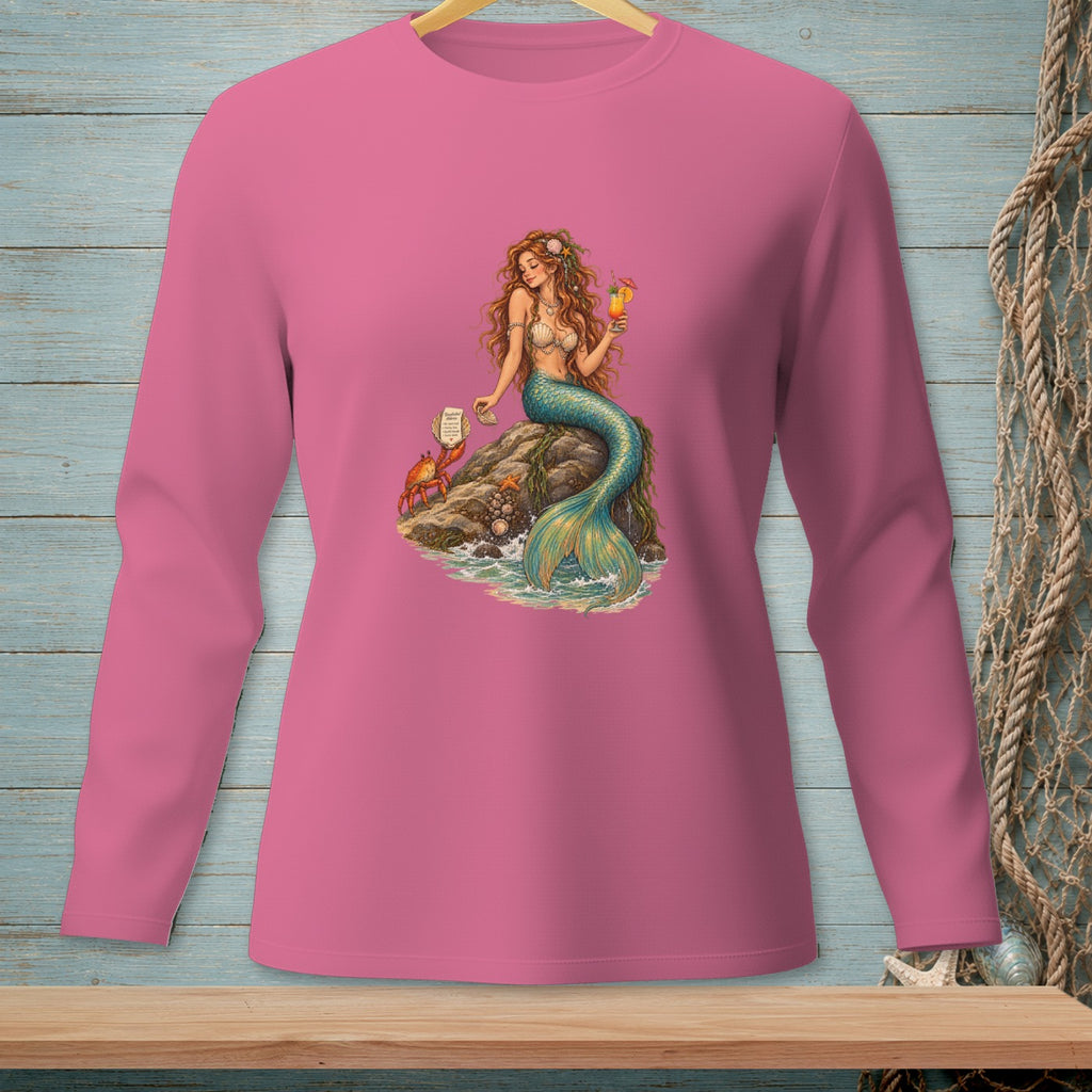 Pink long-sleeve shirt with a mermaid, crab, and drink graphic on a rock.