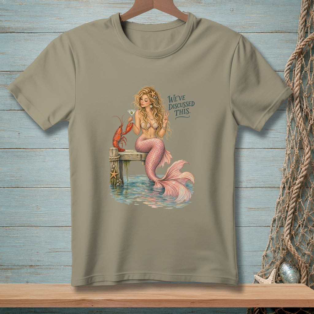 Mermaid on dock with lobster and drink, text "We've discussed this."