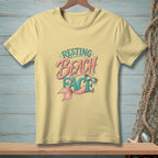 Yellow t-shirt with "Resting Beach Face" graphic and mermaid tail.
