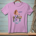 Mermaid with wine glass and bottle on dock with crab and text "HANDLED".