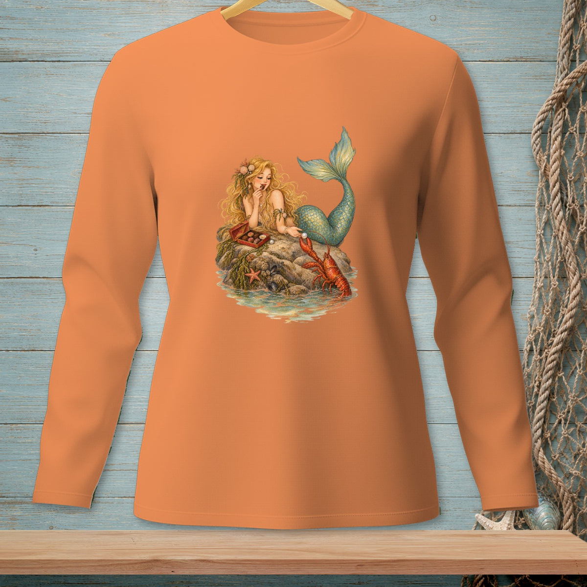 Mermaid sitting on a rock with a lobster and chocolates.