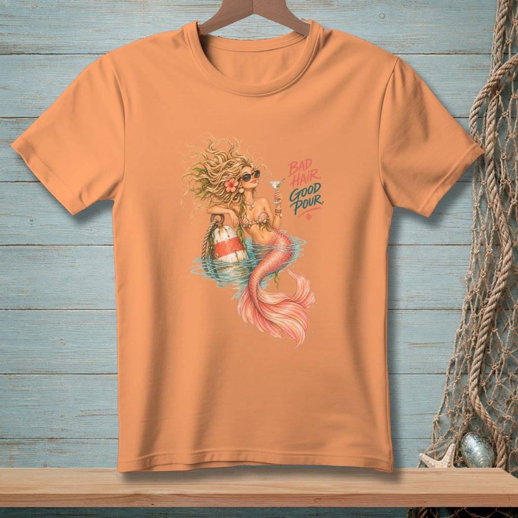Orange t-shirt featuring a mermaid with text "Bad Hair Good Pour".
