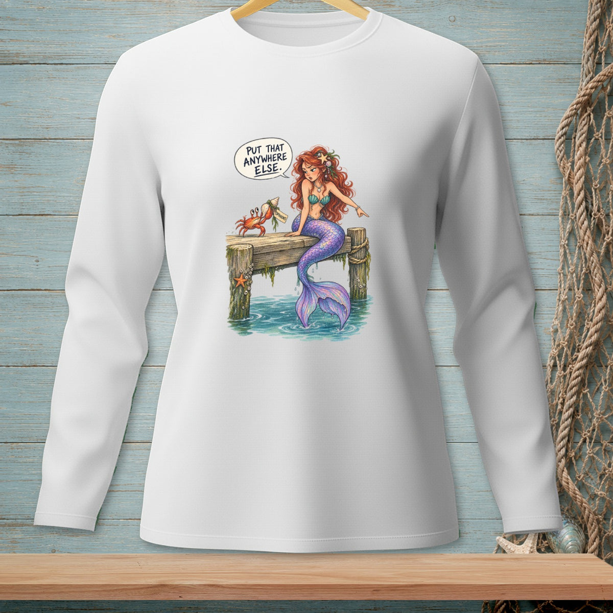 Mermaid on dock with crab, saying "Put that anywhere else."