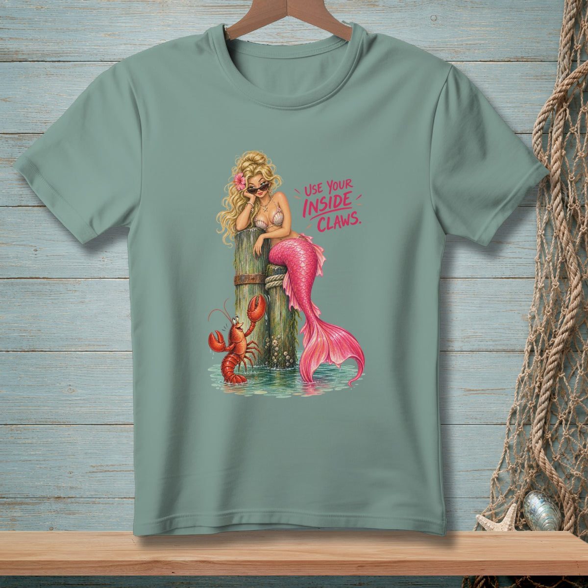 T-shirt with illustration of a mermaid and lobster, text "USE YOUR INSIDE CLAWS".