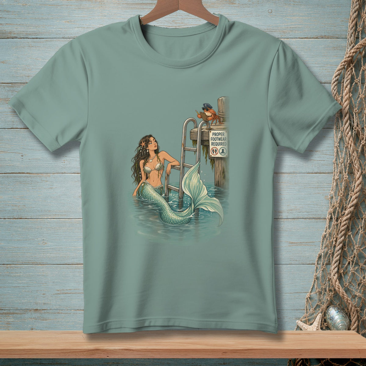 Mermaid at a dock with a crab and "Proper Footwear Required" sign.