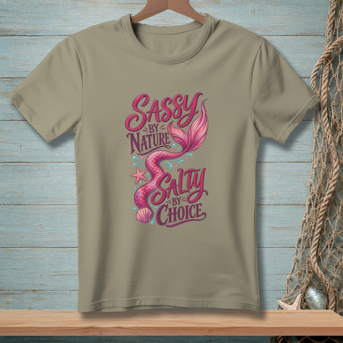 Khaki t-shirt with a mermaid design that reads "Sassy by Nature Salty by Choice".