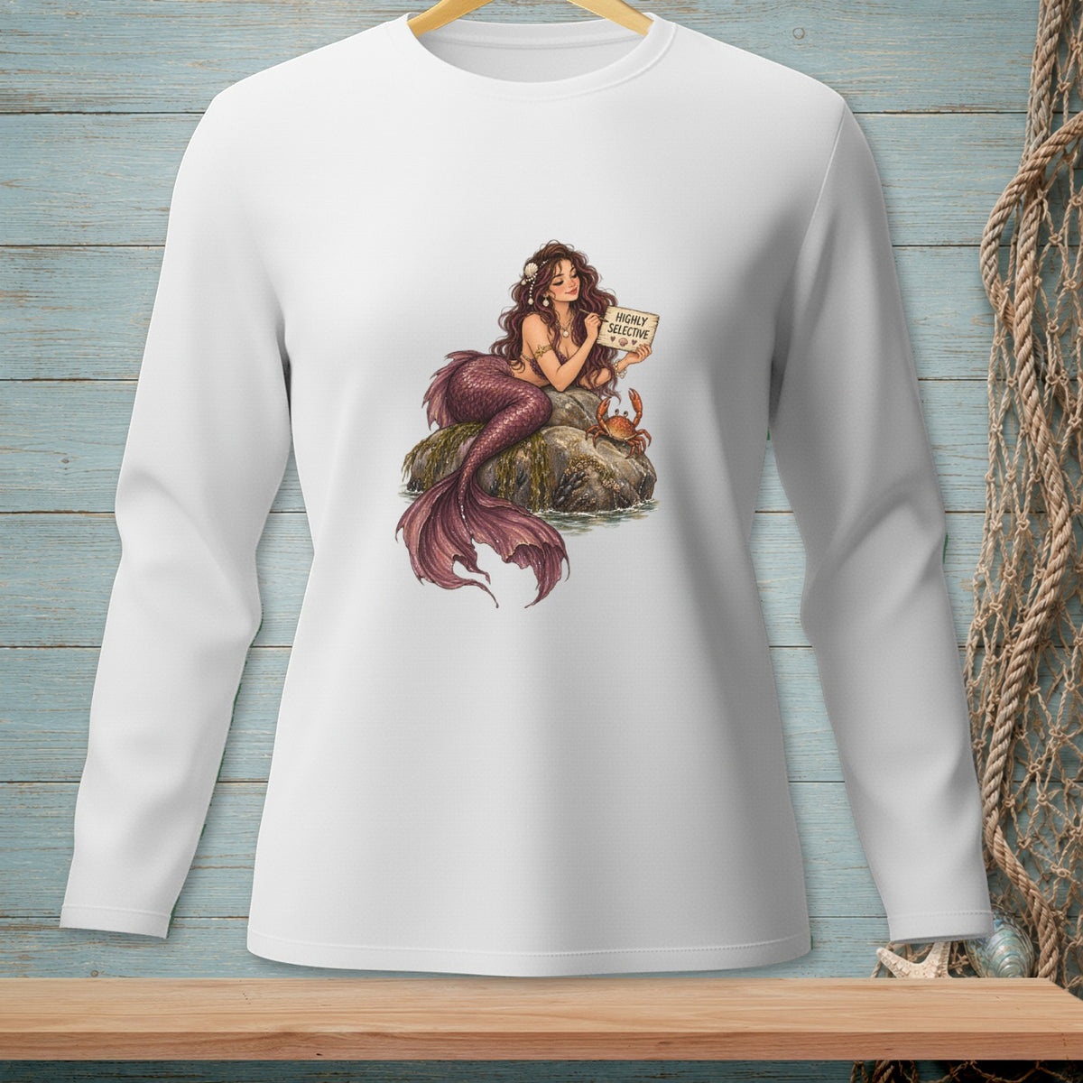 Mermaid sitting on a rock with a crab, holding a "Highly Selective" sign.