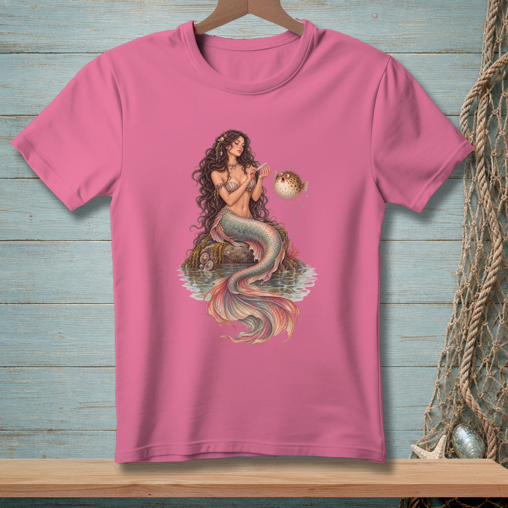 Pink t-shirt with a detailed illustration of a mermaid and a pufferfish.