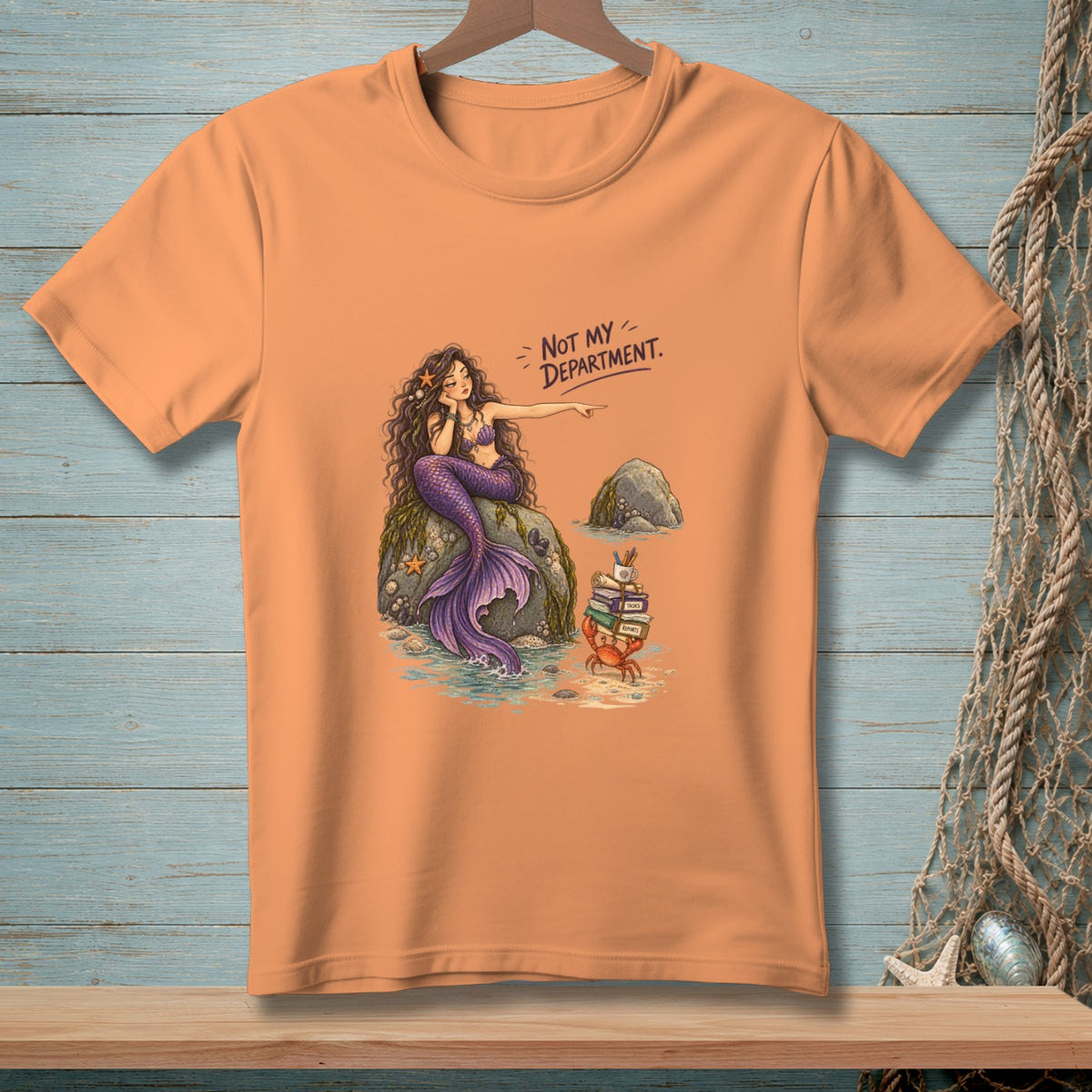 Mermaid points at crab with books; "Not my department" text.