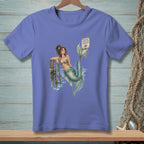 Mermaid lounging by a dock with "Proper Footwear Required" sign.