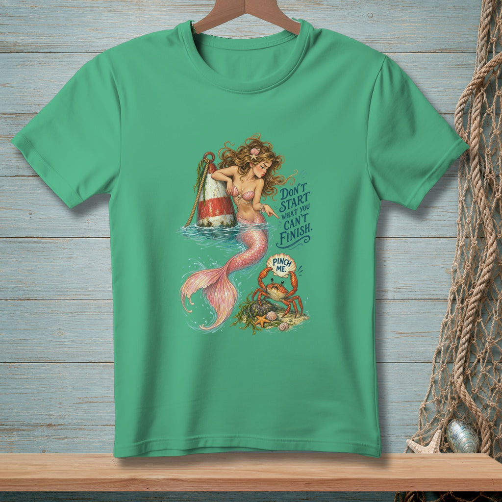Mermaid with a buoy and a crab on a green t-shirt. Text reads "Don't start what you can't finish. Pinch me."