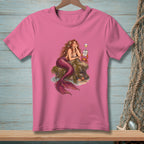 Pink t-shirt featuring a mermaid relaxing on rocks with a crab holding a "Not Accepting Feedback" sign.