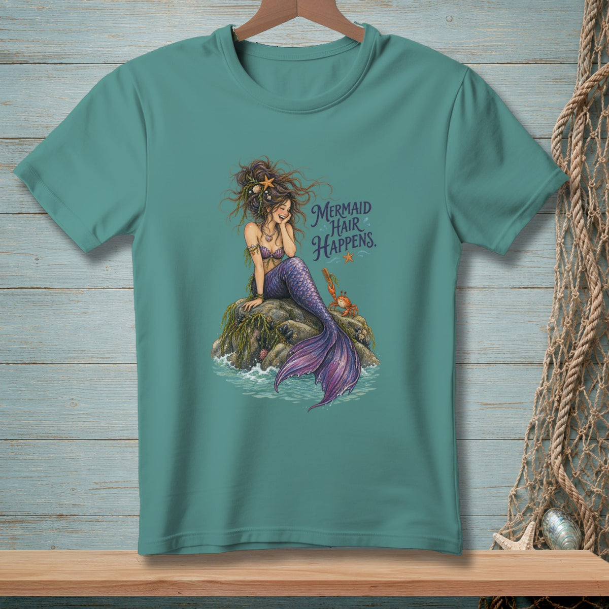 Mermaid with purple tail sitting on rock with text "Mermaid Hair Happens."