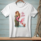 White t-shirt with a mermaid sitting on a post, text reads "The tail has spoken."