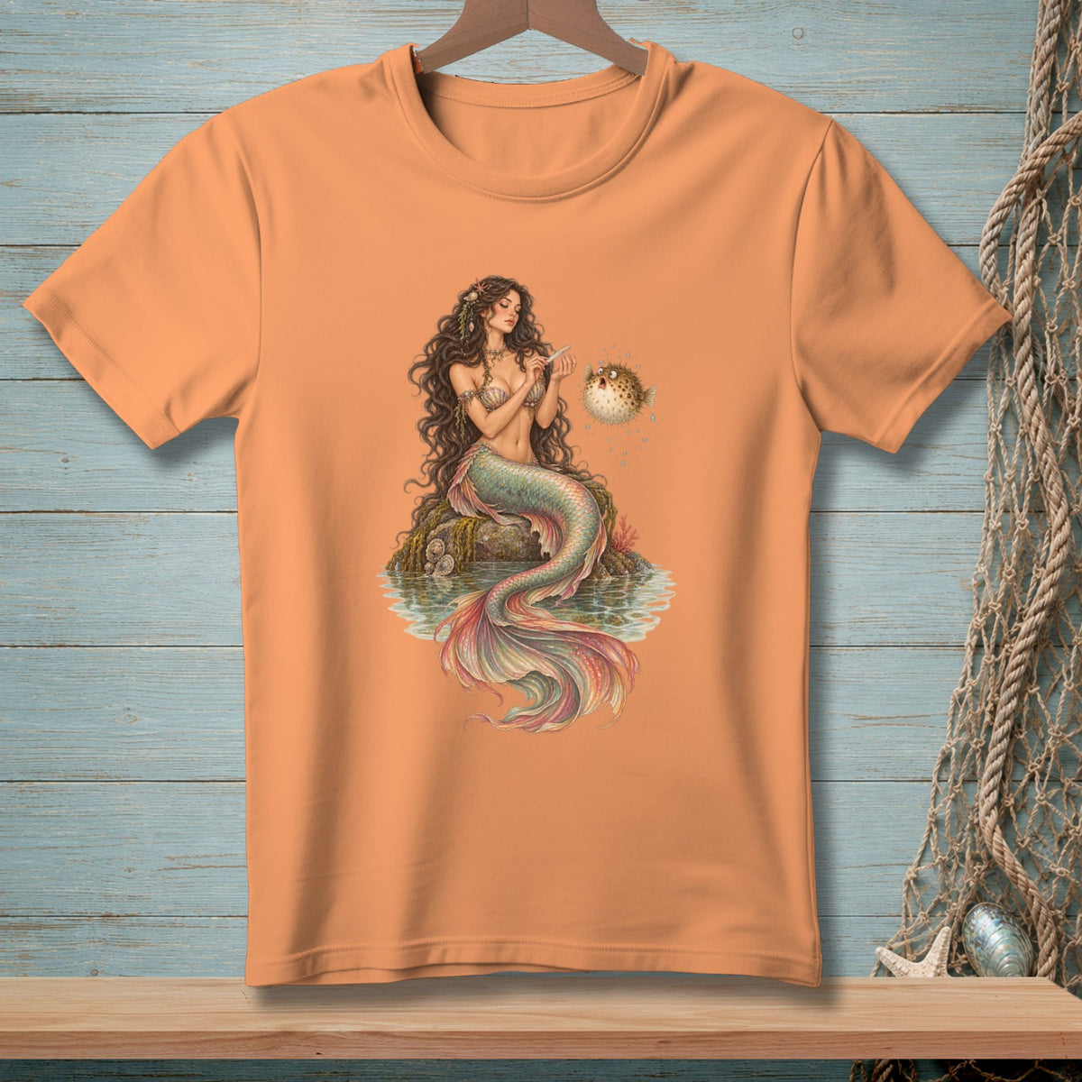 T-shirt with a mermaid and pufferfish illustration.