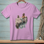 Pink t-shirt with mermaid reading on a dock, text reads "Current Mood."