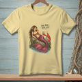 Mermaid with lobster and text "THE BAR WAS LOW" on a pale yellow t-shirt.