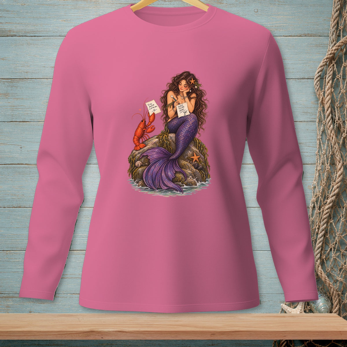 Mermaid on rock with lobster and starfish, holding papers.