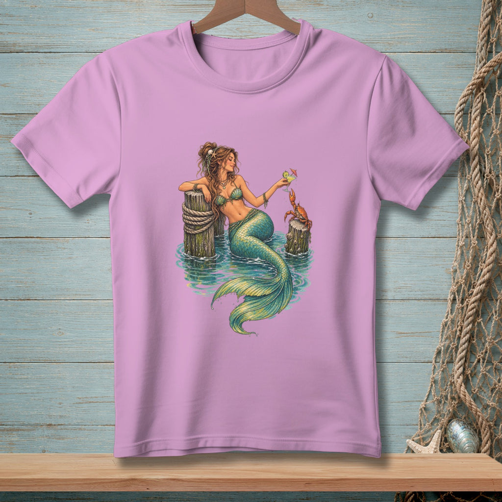 Mermaid holds drink near crab sitting on wooden posts in water.