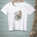 White t-shirt with a watercolor-style print of a mermaid sitting on a rock.