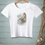 White t-shirt with a watercolor-style print of a mermaid sitting on a rock.