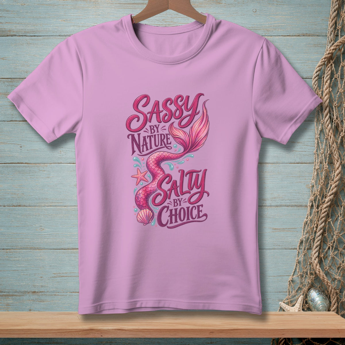 Pink t-shirt with "Sassy by Nature Salty by Choice" text and mermaid graphic.