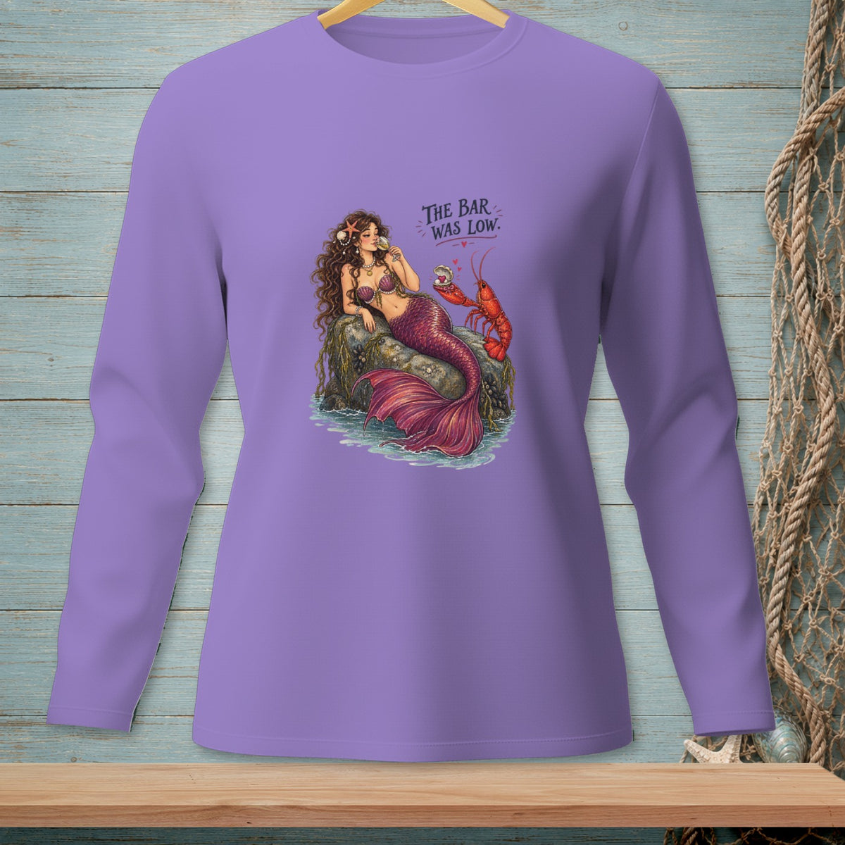 Mermaid with lobster on rock, text reads "The Bar Was Low."