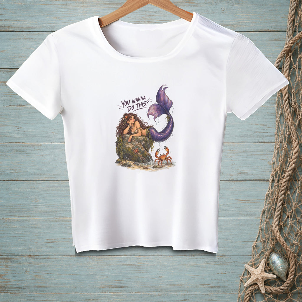 White t-shirt with illustration of a mermaid on a rock with a crab and text "YOU WANNA DO THIS?".