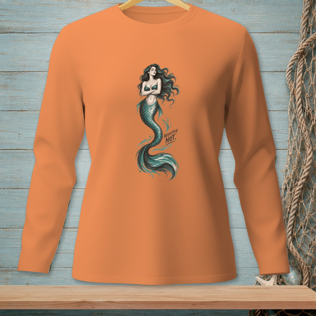 Orange long-sleeve shirt with a mermaid graphic and "ABSOLUTELY NOT." text.