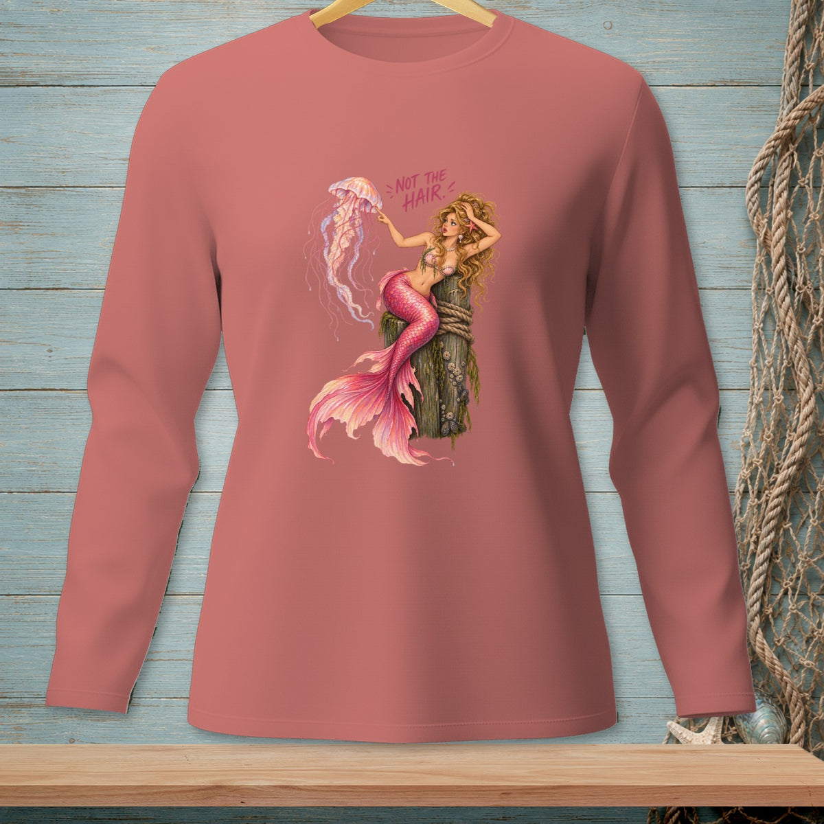 Mermaid with jellyfish on a post, text reads "NOT THE HAIR."