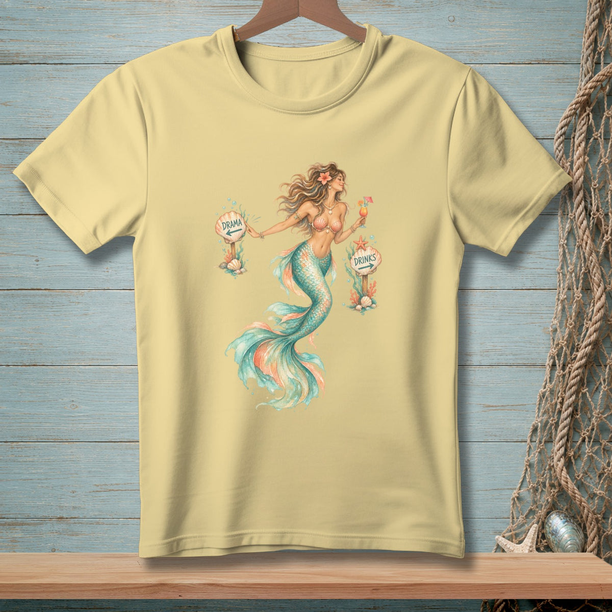 Light yellow t-shirt featuring a watercolor mermaid with "Drama" and "Drinks" signs.