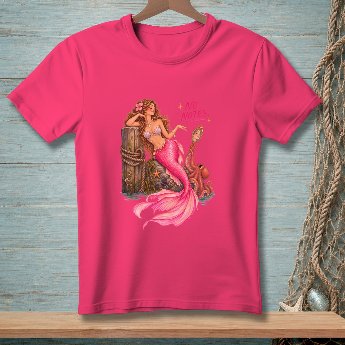 Pink t-shirt with mermaid graphic and text "NO NOTES."