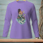 Purple long-sleeve shirt with a mermaid reading a map and a fish.