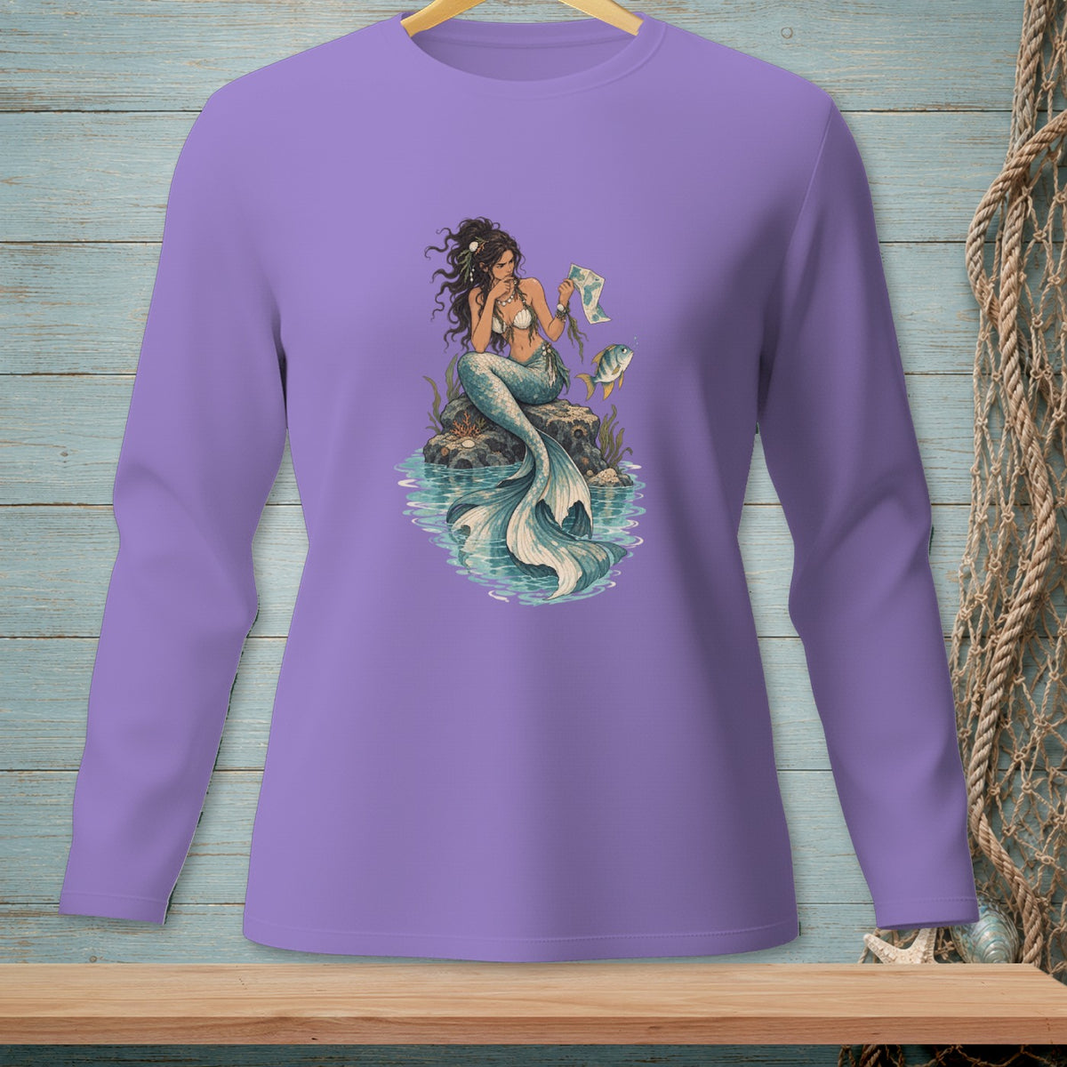 Purple long-sleeve shirt with a mermaid reading a map and a fish.