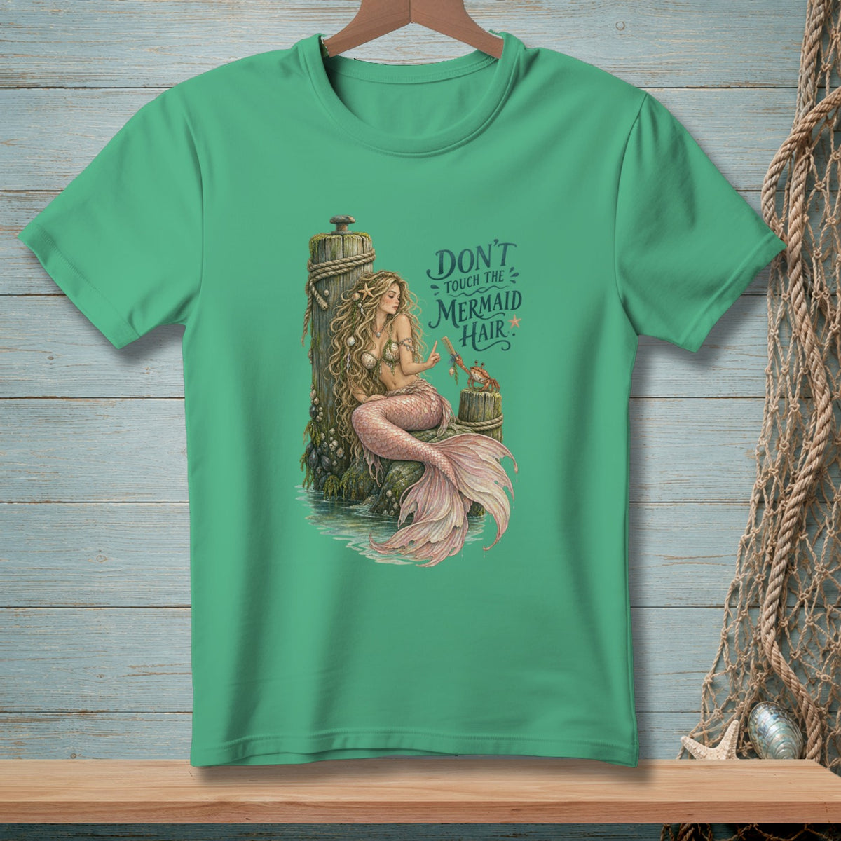 Mermaid sitting on a post with text "Don't Touch The Mermaid Hair".