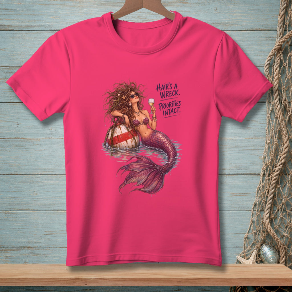 Pink t-shirt with mermaid graphic and text "Hair's a wreck. Priorities intact."