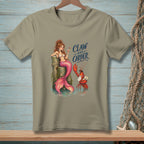 Mermaid and lobster with text "Claw and Order" graphic on a tan t-shirt.
