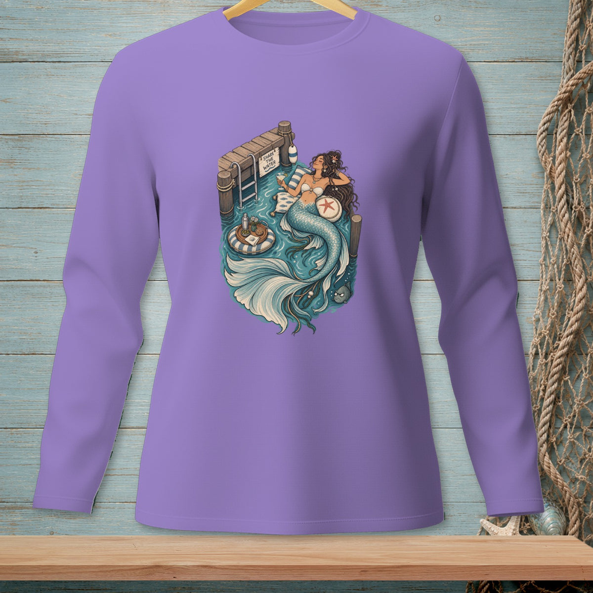 Mermaid relaxing on a dock, text "SHARE THE WATER" on sign.